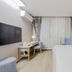 Home Inn Neo Shanghai Pudong Airport guest room with bed, desk, TV, and curtains in Shanghai