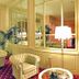 Grand Hotel La Pace Sorrento lounge with tufted armchairs, mirrored walls and table lamp