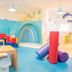 Iberostar Waves Gaviotas Park in Jandía, colorful kids' playroom with slides and ocean-themed mural