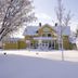 Hotell Björkhaga in Mullsjö, snow-covered yellow hotel exterior with frosted trees and winter landscape