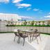 Aishangyijia Hotel (Wuhu Zhongshan Road Pedestrian Street Branch) rooftop terrace with table and chairs