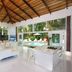Le Cameleon Boutique Hotel in Puerto Viejo de Talamanca lobby with chandelier and pool view