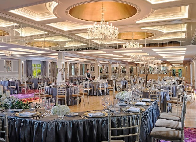 Fitzgeralds Woodlands House Hotel in Adare ballroom with chandeliers and round banquet tables