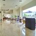 Horison Hotel Sukabumi lobby with polished marble floor, seating area, and bright windows