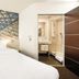 B&B HOTEL Katowice Centrum room with bed and glass-enclosed bathroom in Katowice