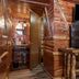 Log Cabin Inn in Eureka Springs rustic wood-paneled cabin room with mini fridge and microwave