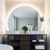 1.75 Paris La Source bathroom with double sinks, round backlit mirror and freestanding tub in Paris