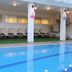 C Hotel Tiberias indoor pool with lounge chairs and covered deck in Tiberias
