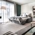 Steigenberger Hotel Treudelberg Hamburg guest room with bed, seating area and adjoining dining space