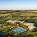 Sheraton Colonia Golf & Spa Resort in Colonia del Sacramento with golf course, pool and pond views