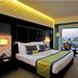 Hues Boutique Hotel Dubai guest room with king bed and large window view of the water