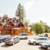Penzion Snezienka in Tatranska Lomnica with chalet-style exterior and parked cars