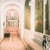 Hotel Villa Klemm - Wiesbaden City hallway with arched ceiling, wood floor, and green wall panels in Wiesbaden
