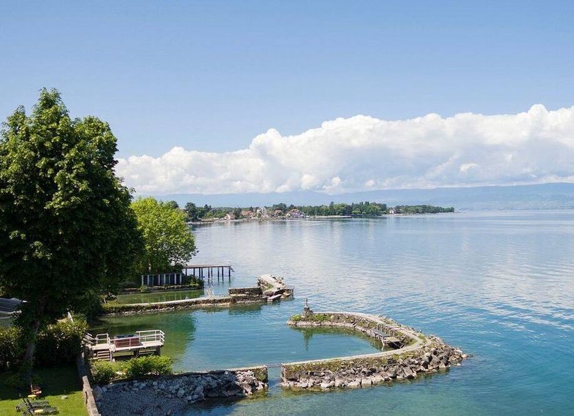 Hôtel Des Princes in Évian-les-Bains with lakefront pool and calm water views