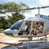 Ka'ana Resort San Ignacio helicopter on lawn with passengers