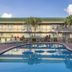 Ocean Breeze Inn Vero Beach pool and palm-lined courtyard in Vero Beach