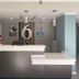 Studio 6 Vicksburg, MS lobby front desk with number 6 wall sign and hanging pendant lights