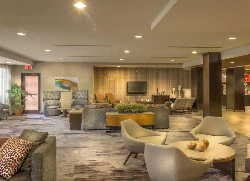 Courtyard by Marriott Greensboro Airport lobby lounge in Greensboro with seating and TV
