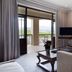 Asara Wine Estate & Hotel in Stellenbosch suite with balcony view, sofa, armchair and TV