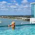 Pumicestone Blue in Caloundra rooftop pool with ocean and shoreline views