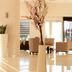 Orty Airport Hotel in Izmir lobby lounge with beige seating, polished floor, and tall floral arrangements