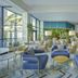 Hilton Skanes Monastir Beach Resort lounge with blue armchairs and large windows in Monastir