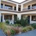 Harvest Lodge in Hastings courtyard with landscaped garden and upper-level balconies