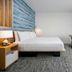 TownePlace Suites by Marriott Brunswick guest room with king bed, desk, TV and large window