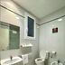Pensión Peiró bathroom in Barcelona with sink, toilet, bidet, and wall mirror