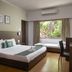 The Hawaii Comforts, Panaji: guest room with double bed, window seat, desk, and air conditioner