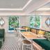 The Prestige Hotel Penang in George Town dining room with green booths, patterned floor, and garden-view windows