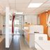 Première Classe Châlons-en-Champagne lobby with orange-accented reception desk and seating area in Saint-Martin-sur-le-Pré