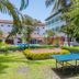 Sarges Hotel in Serrekunda with gardens, a ping pong table, and a poolside area