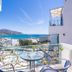 Afroditi Apartments in Makry Gialos with sea view from a balcony and outdoor seating