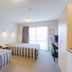 Bella Vista Motel Hokitika room with two single beds, desk, TV and balcony door