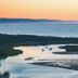 Noosa River Retreat in Noosa Heads with river inlet, boats, and sunset over the water