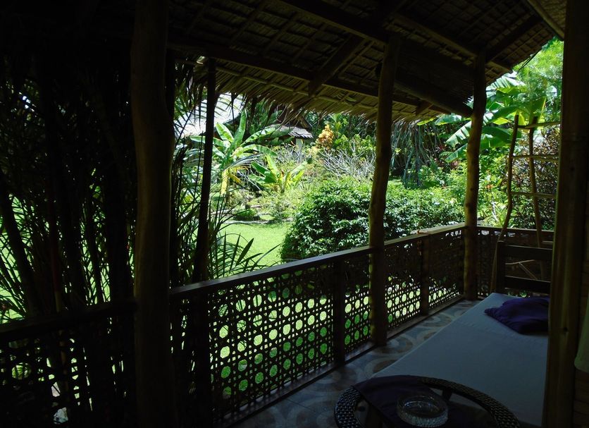 Nypa Style Resort Camiguin in Mambajao: shaded balcony with garden and tropical view