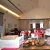 Casalgrande Hotel in Salvaterra breakfast buffet with fruit, pastries and set tables in a dining room