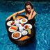 Fullmoon Villa Ubud in Ubud: woman enjoying a floating breakfast tray in the pool