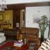Hostal Bogotá Real in Bogotá lounge with chandelier, leather sofa, armchairs and patterned rug