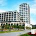 Howard Johnson by Wyndham Parkland Hotel Dalian exterior with modern tower and landscaped grounds