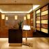 Howard Johnson by Wyndham Parkland Hotel Dalian lobby with warm lighting and seating area
