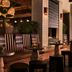 HOLLYWOOD VOLUME, a Tribute Portfolio Hotel in Los Angeles, featuring a stylish lounge with candlelit tables