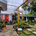 Casa Jardin Del Mango in San José courtyard with garden path, patio seating, and lush plants