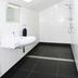 Bon Marie B&B in Hamilton bathroom with skylight, tiled walk-in shower, and wall-mounted sink