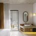 Basq House Byron Bay guest room with balcony and sunlit outdoor seating