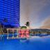 Fiesta Americana Acapulco Villas rooftop pool at dusk with ocean and mountain views in Acapulco