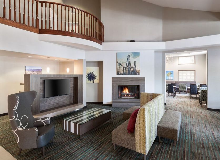 Residence Inn by Marriott Santa Clarita Valencia lobby with fireplace, TV area and seating