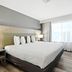 Country Inn & Suites by Radisson, Merrilville, IN room with king bed and large window in Merrillville