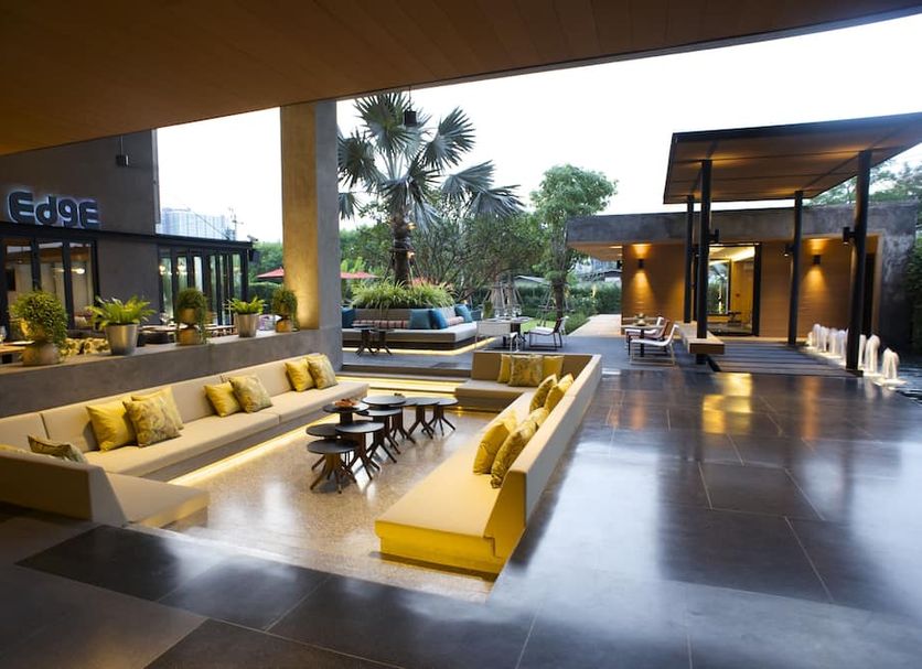The Silver Palm Wellness Resort in Bangkok with open-air lounge seating and landscaped courtyard
